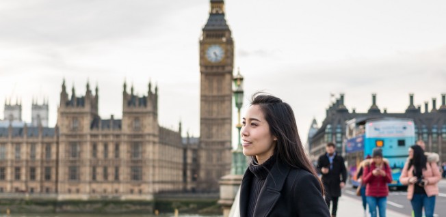 asian businesswoman in london (big ben in background)