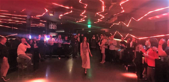Fashion Show in a Club with Red &amp; Pink Stroboscope Lights