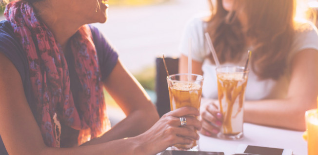 women drinking coffee at a cafe